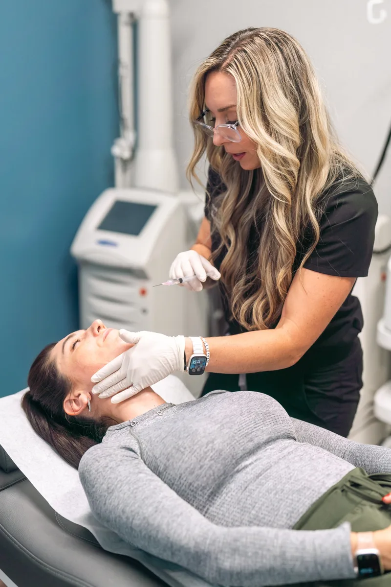 Dr. Amanda Hill performing a regenerative treatment