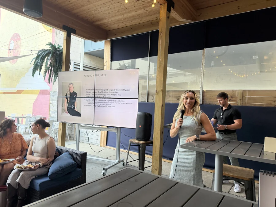 Dr. Amanda Hill presenting her bio slide at a speaking event